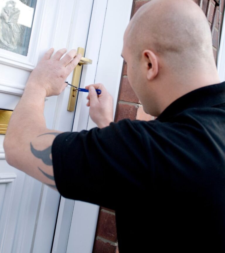BlackShield emergency locksmith arriving at a Regina home at night
