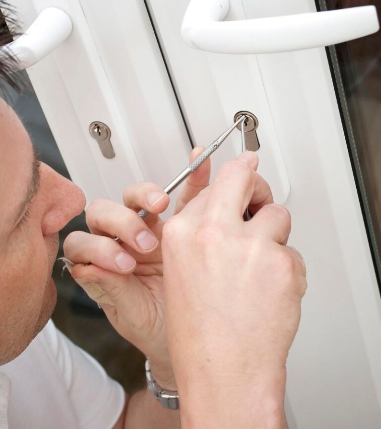 BlackShield commercial locksmith working on a business door lock in Regina