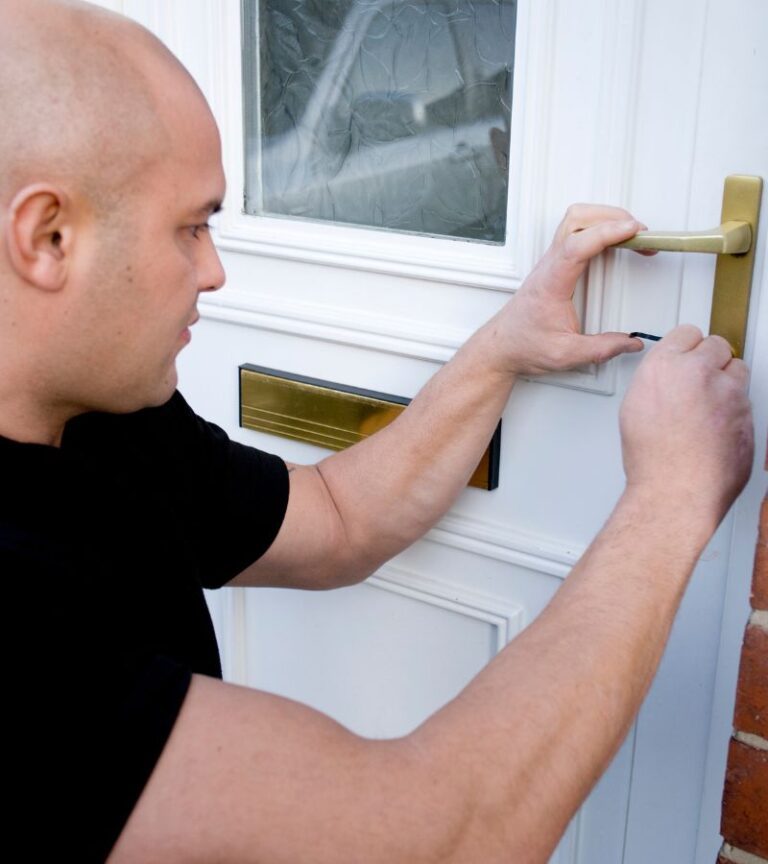 BlackShield locksmith at a Regina home front door in daylight